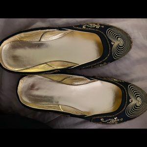 Black and gold slippers